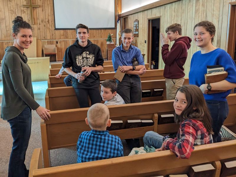 Members visiting in the pews after a service